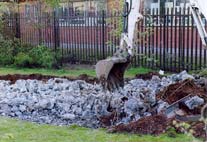 Removing concrete from pond hole